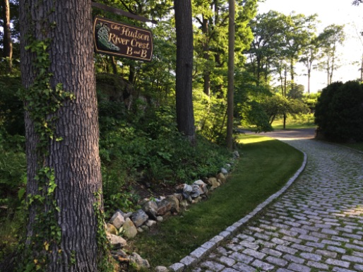 Look for the cobblestone drive off of River Crest Road. (Third Driveway on the right.)